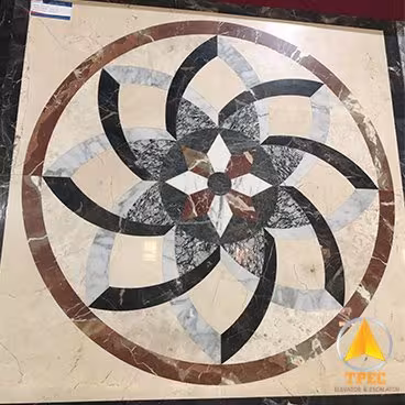 Sàn thang máy đá marble hoa văn tròn hình chong chóng xoáy, phối đá be, xám và nâu đỏ